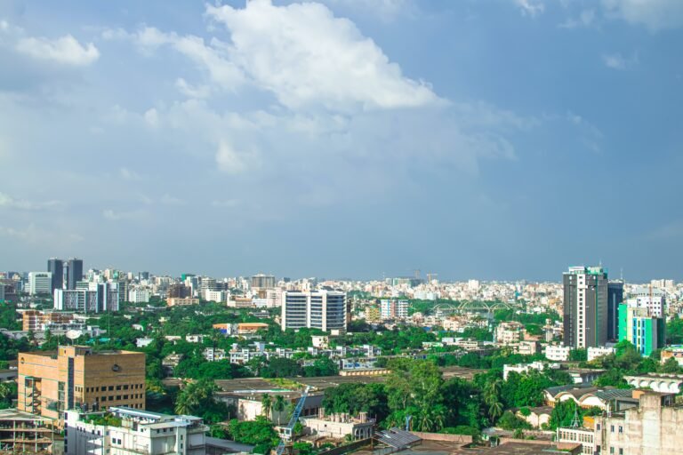 Aerial view of the Dhaka skyline with buildings and trees