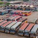 Rows of buses parked at a bus terminal