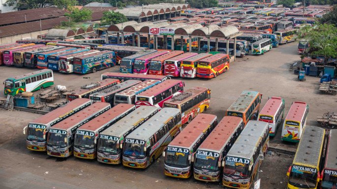 Rows of buses parked at a bus terminal